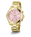 A gold-tone stainless steel wristwatch with a pink sunburst dial, featuring three subdials, gold-tone hour markers, and a matching gold-tone metal link bracelet. The brand name 'GUESS' is printed on the dial.