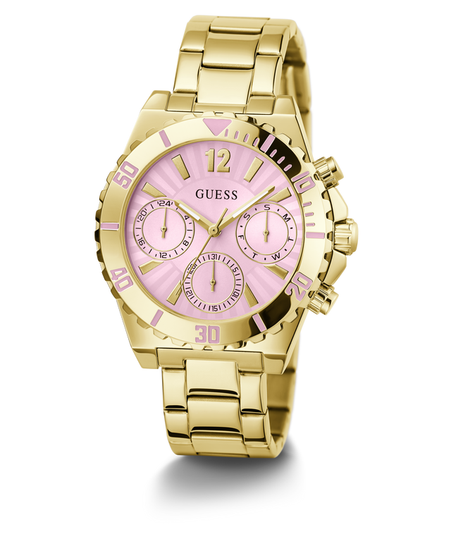 A gold-tone stainless steel wristwatch with a pink sunburst dial, featuring three subdials, gold-tone hour markers, and a matching gold-tone metal link bracelet. The brand name 'GUESS' is printed on the dial.