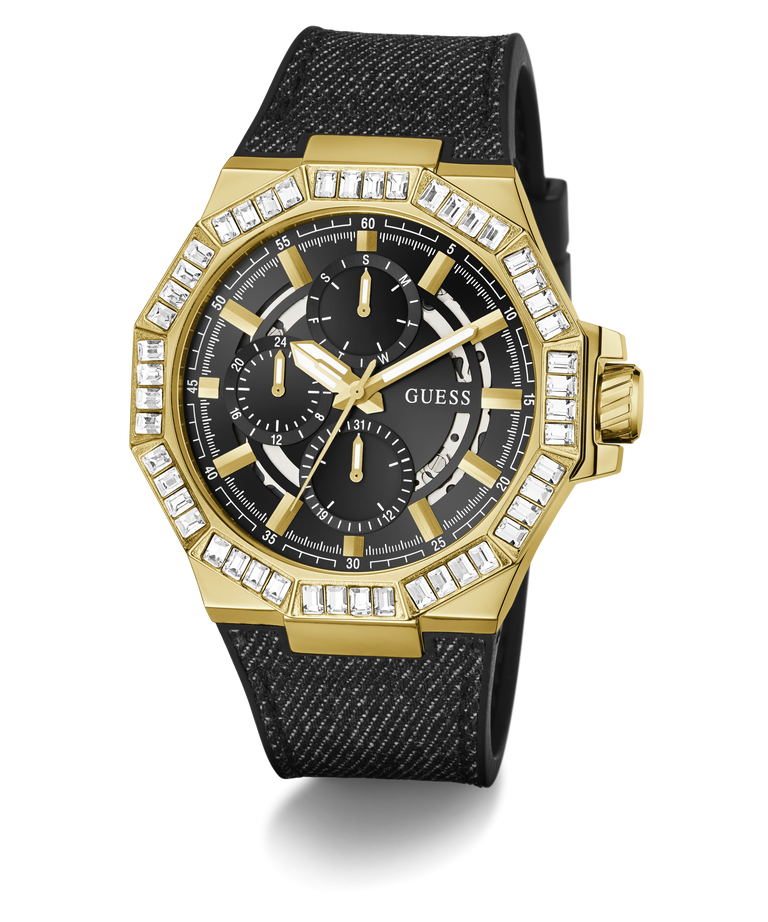 A gold-tone GUESS chronograph watch with a black textured strap, featuring a bezel set with clear crystals and a black dial with gold hands and subdials.