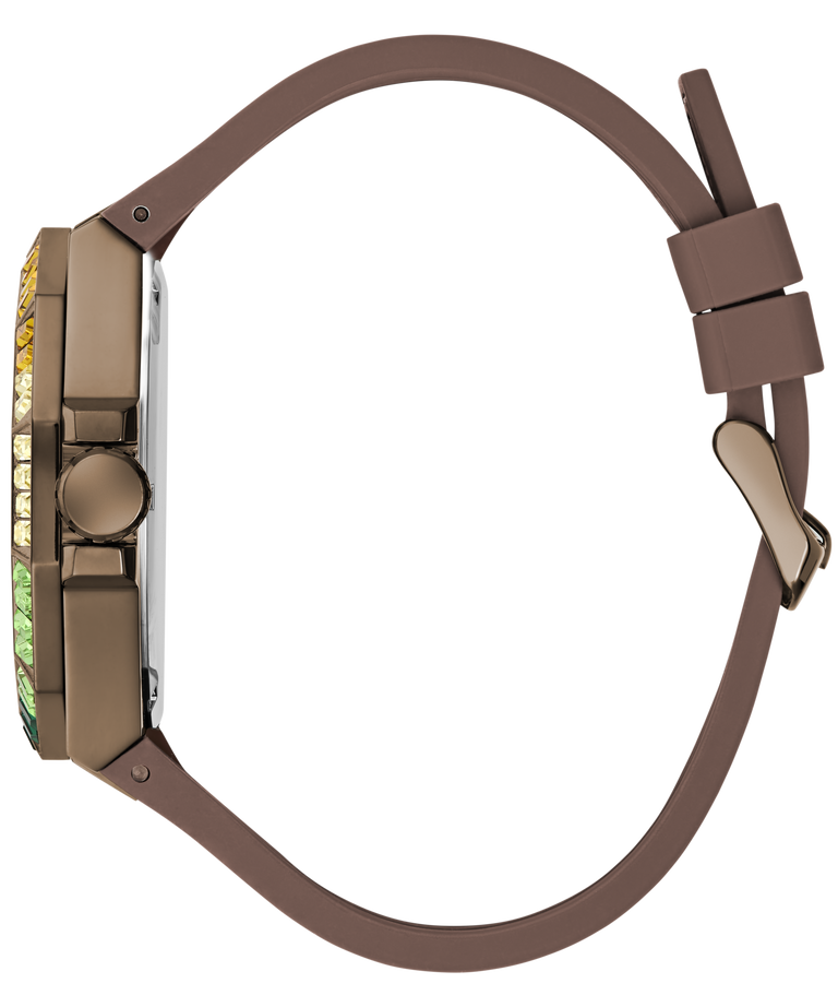 A side profile view of a luxury watch featuring a matte brown silicone strap, a bronze-toned case, and a bezel accented with green and yellow diamonds.