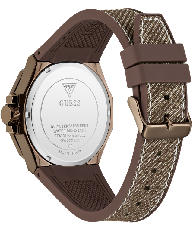 Rear view of a Guess watch with a brown textured silicone strap and a rose gold case, showing the stainless steel case back engraved with the Guess logo.