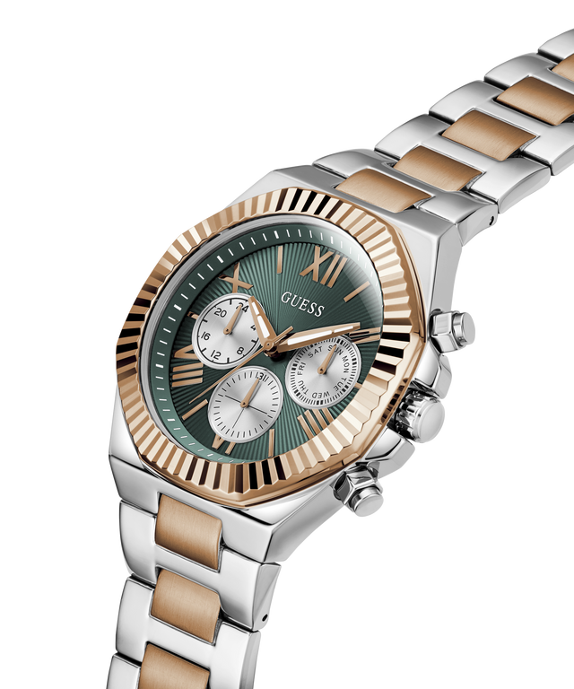 A Guess men's analog watch with a green dial, fluted rose gold bezel, and a two-tone silver and rose gold stainless steel link bracelet, shown on a white background. lifestyle
