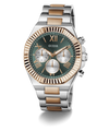 A GUESS men's chronograph watch featuring a two-tone silver and rose gold stainless steel bracelet, a fluted rose gold bezel, and a dark green dial with silver sub-dials.