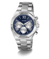 A GUESS men's analog watch with a silver stainless steel case and link bracelet, featuring a deep blue dial with silver-tone subdials and Roman numeral hour markers.