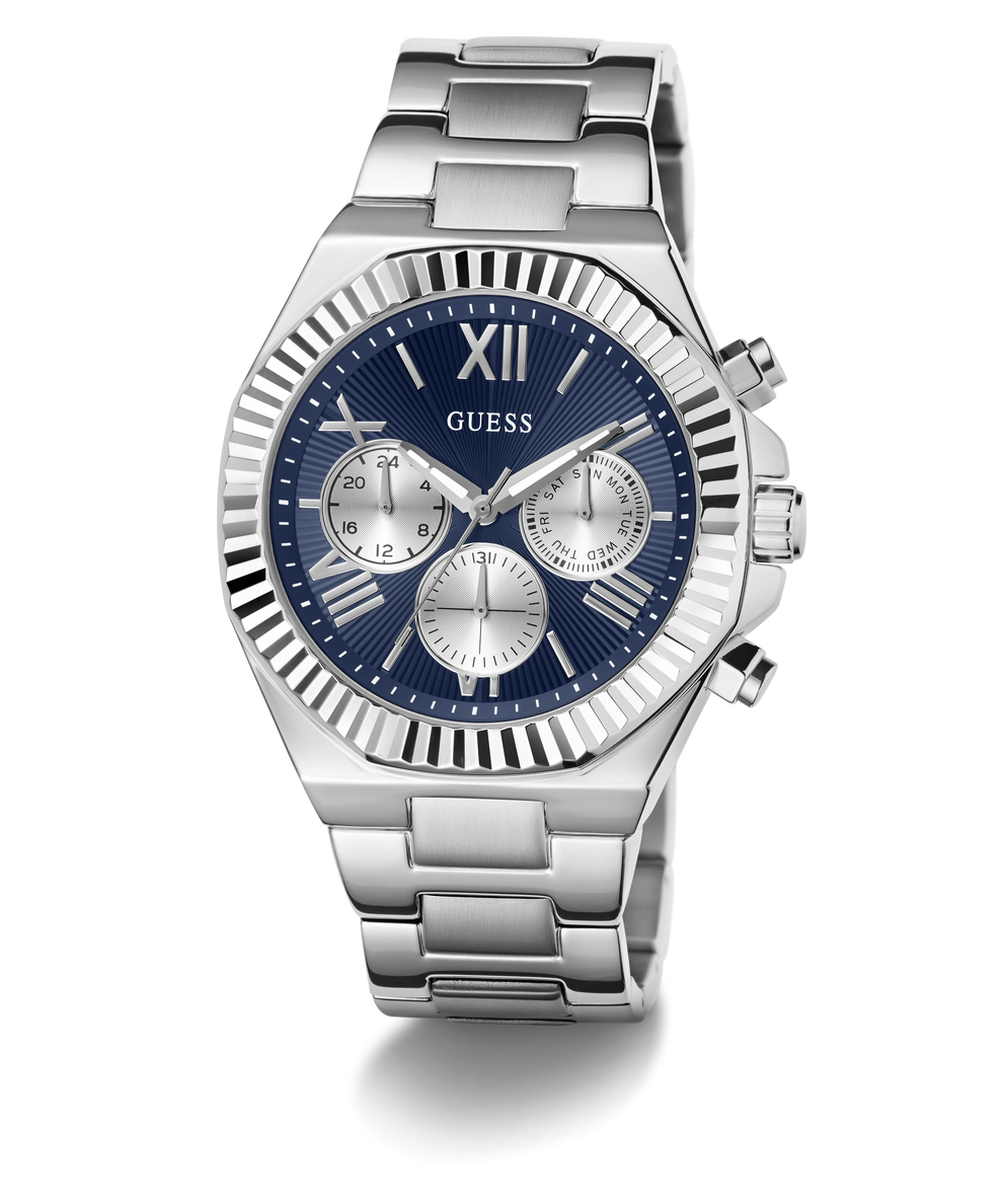 A GUESS men's analog watch with a silver stainless steel case and link bracelet, featuring a deep blue dial with silver-tone subdials and Roman numeral hour markers.