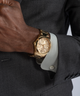 GUESS Mens Gold Tone Multi-function Watch lifestyle watch on wrist grey jacket