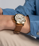 GUESS Mens Brown Gold Tone Multi-function Watch lifestyle watch on arm blue shirt