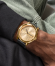 GUESS Mens Black Gold Tone Analog Watch lifestyle watch on wrist