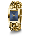 Gold GUESS Ladies Mod Heavy Metal Gold Tone Analog Watch with blue face and 'Guess' branding on a white background