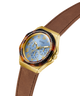 GUESS Ladies Brown Gold Tone Multi-function Watch with a brown strap on a white background lifestyle