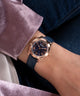 GW0761L2 GUESS Ladies Blue Rose Gold Tone Analog Watch watch on arm