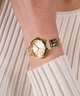 GW0762L2 GUESS Ladies Gold Tone Analog Watch lifestyle watch on model