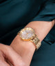 GW0763L2 GUESS Ladies Gold Tone Analog Watch watch on wrist