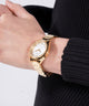 GW0767L2 GUESS Ladies Gold Tone Analog Watch watch on arm