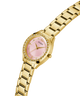 Gold watch with a pink face on a white background lifestyle