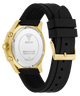 Guess watch with black strap and gold case on a white background