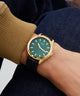 GW0846G1 GUESS Mens Black Gold Tone Analog Watch watch on wrist