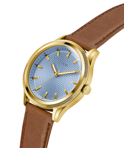 Watch with gold case, blue dial, and brown leather strap on a white background lifestyle