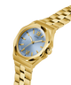GUESS Mens Gold Tone Analog Watch with a light blue face and Roman numeral markers on a white background lifestyle