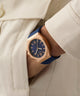 GW0850G3 GUESS Mens Blue Rose Gold Tone Analog Watch watch on model