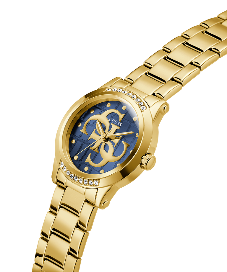 Gold watch with blue face and visible brand logo on a white background lifestyle