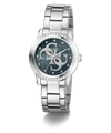 A Guess women's analog watch with a silver stainless steel link bracelet, a round bezel set with clear crystals, and a dark blue dial featuring the brand's interlocking G logo.