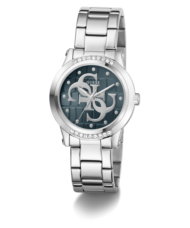 A Guess women's analog watch with a silver stainless steel link bracelet, a round bezel set with clear crystals, and a dark blue dial featuring the brand's interlocking G logo.