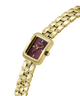 A gold-tone Guess watch with a rectangular purple dial and a matching gold-tone link bracelet, shown on a plain white background. lifestyle