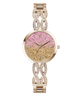A women's rose gold-tone wristwatch with a glittery pink-to-gold gradient dial and a matching crystal-studded link bracelet, shown on a plain white background.