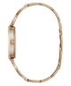A rose gold metal watch with a matching link bracelet, shown from a side profile view against a solid white background.