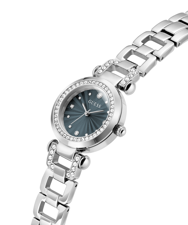 A silver-tone stainless steel wrist watch with a dark teal sunburst dial, crystal-studded bezel, and matching crystal-accented link bracelet, shown on a white background. lifestyle