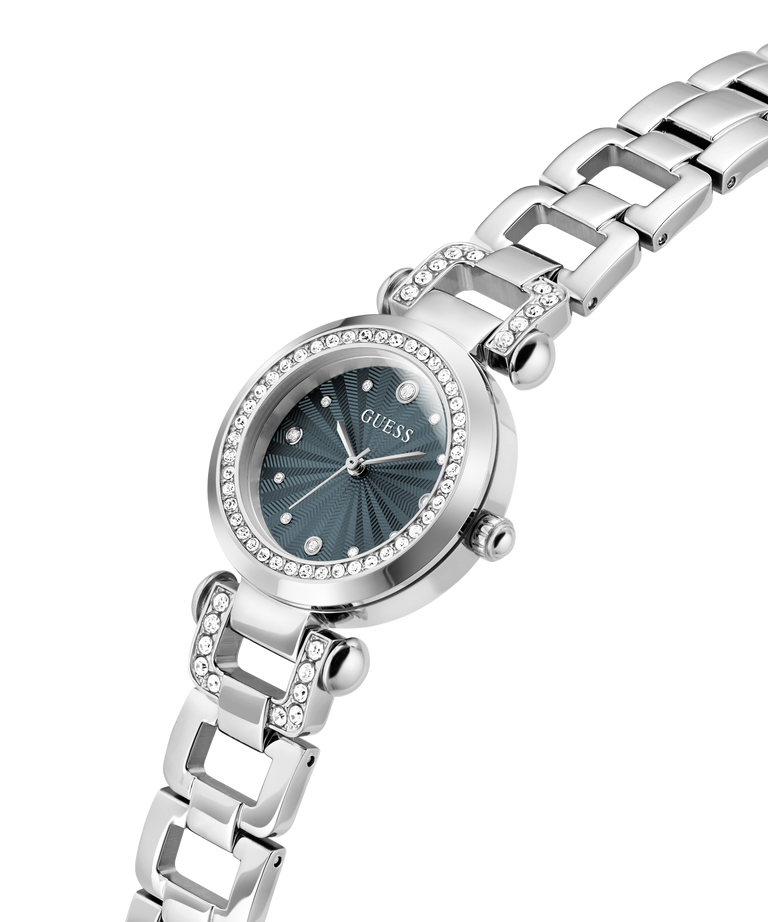 A silver-tone stainless steel wrist watch with a dark teal sunburst dial, crystal-studded bezel, and matching crystal-accented link bracelet, shown on a white background. lifestyle