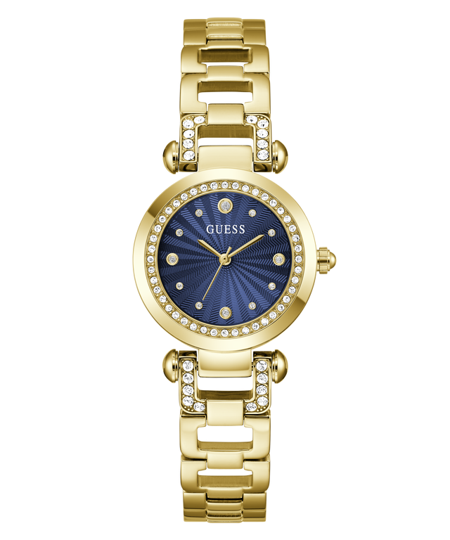 A gold-tone Guess watch with a blue sunburst dial and crystal-studded bezel, shown on a plain white background.