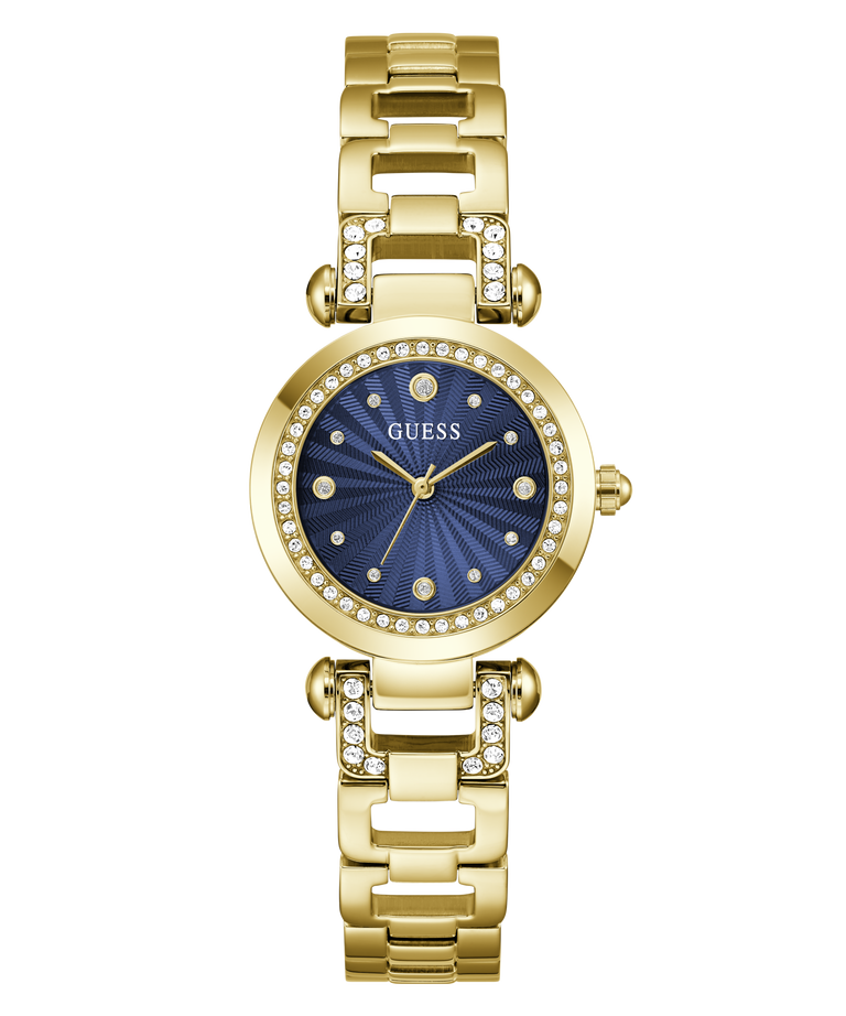 A gold-tone Guess watch with a blue sunburst dial and crystal-studded bezel, shown on a plain white background.
