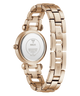 Rose gold stainless steel women's watch shown from the back, featuring a matching link bracelet and a round case with a clear back cover displaying the GUESS brand name.