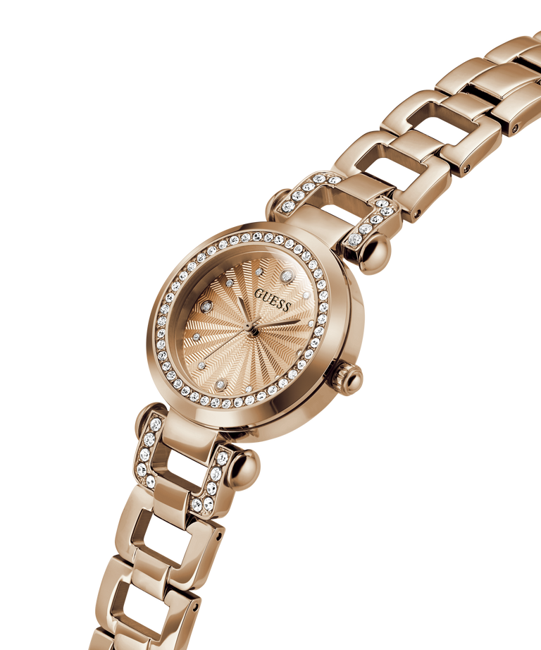 Gold watch with diamond-studded face on a white background lifestyle
