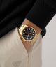 GW0900G3 GUESS Mens Gold Tone Multi-function Watch watch on arm