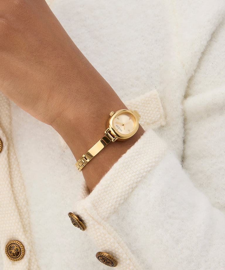 Gold watch on a wrist with a white coat background GW0924L2