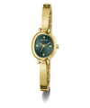 A gold-tone women's bangle watch by Guess with an oval green dial and matching green bezel, shown on a clean white background.