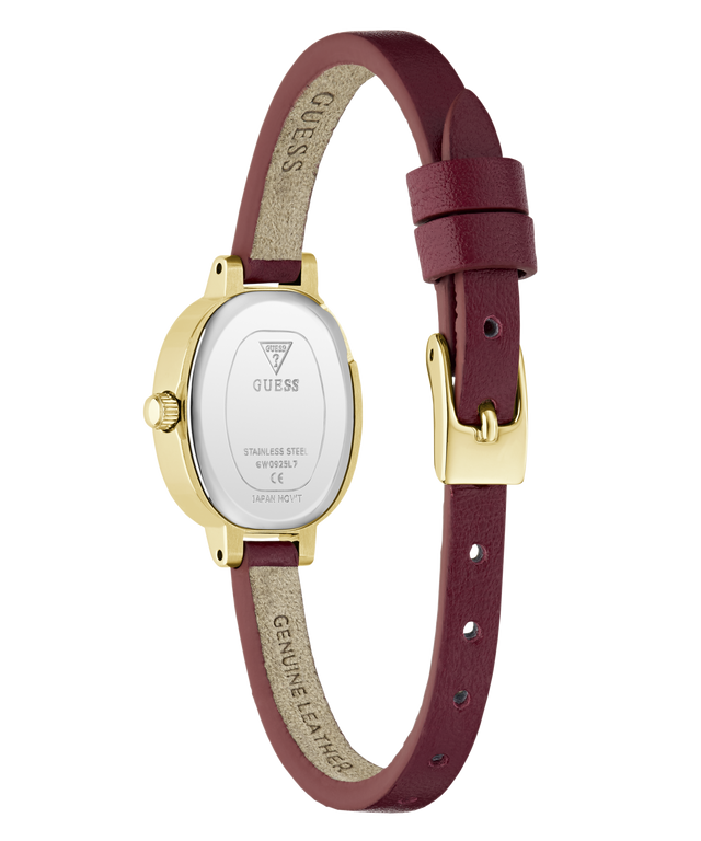 The back view of a Guess watch with a gold-tone case and a burgundy leather strap, showing the brand name 'GUESS' printed on the inner strap and the stainless steel case back.