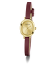 A GUESS women's watch featuring an oval gold-tone case, a gold dial with crystal hour markers, and a dark burgundy leather strap, shown against a plain white background.