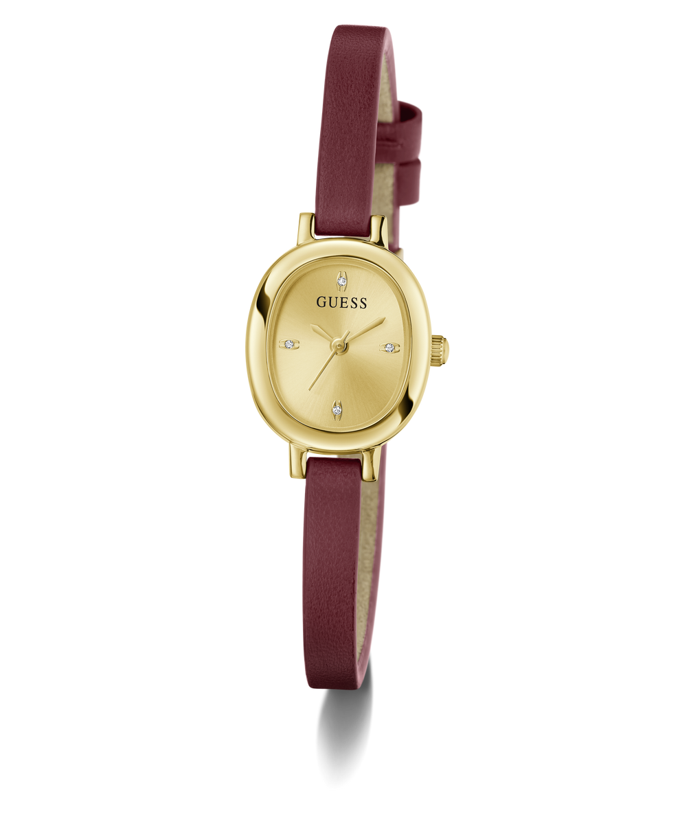 A GUESS women's watch featuring an oval gold-tone case, a gold dial with crystal hour markers, and a dark burgundy leather strap, shown against a plain white background.