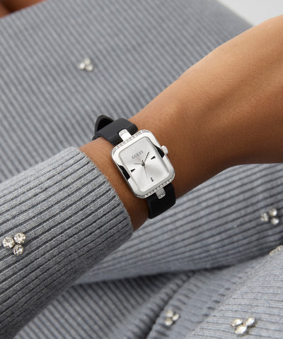 Silver watch with black strap on a wrist wearing a gray sweater with crystal embellishments. GW0926L1