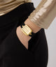 Gold watch on a wrist with a plain background GW0926L2