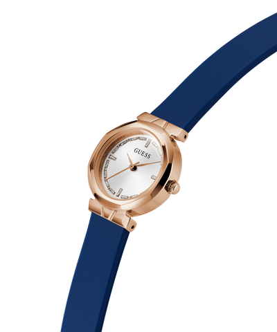 Guess watch with blue strap and rose gold case on white background lifestyle