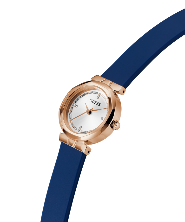 Guess watch with blue strap and rose gold case on white background lifestyle