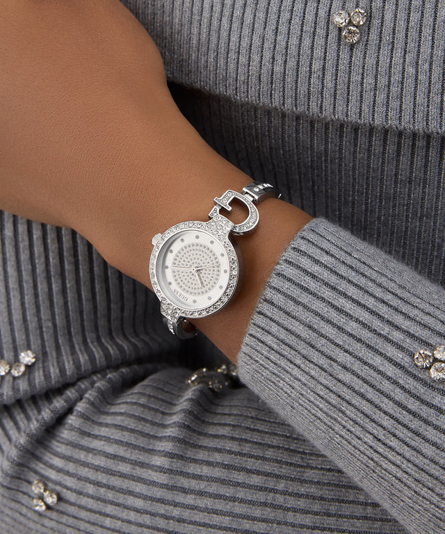 Silver watch on a wrist with a gray ribbed sweater GUESS Ladies Silver Tone Analog Watch