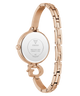 GUESS Ladies Rose Gold Tone Analog Watch caseback with a white face on a white background