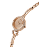 GUESS Ladies Rose Gold Tone Analog Watch with diamond-studded strap on a white background lifestyle