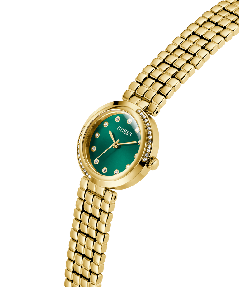 Gold watch with a green face on a white background lifestyle